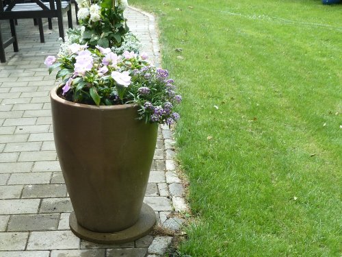 Rubber stepping stone under flower pot